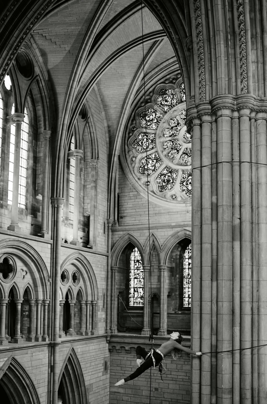 Georgie Barnett from Yskynna Vertical Dance Company rehearsing in Truro Cathedral